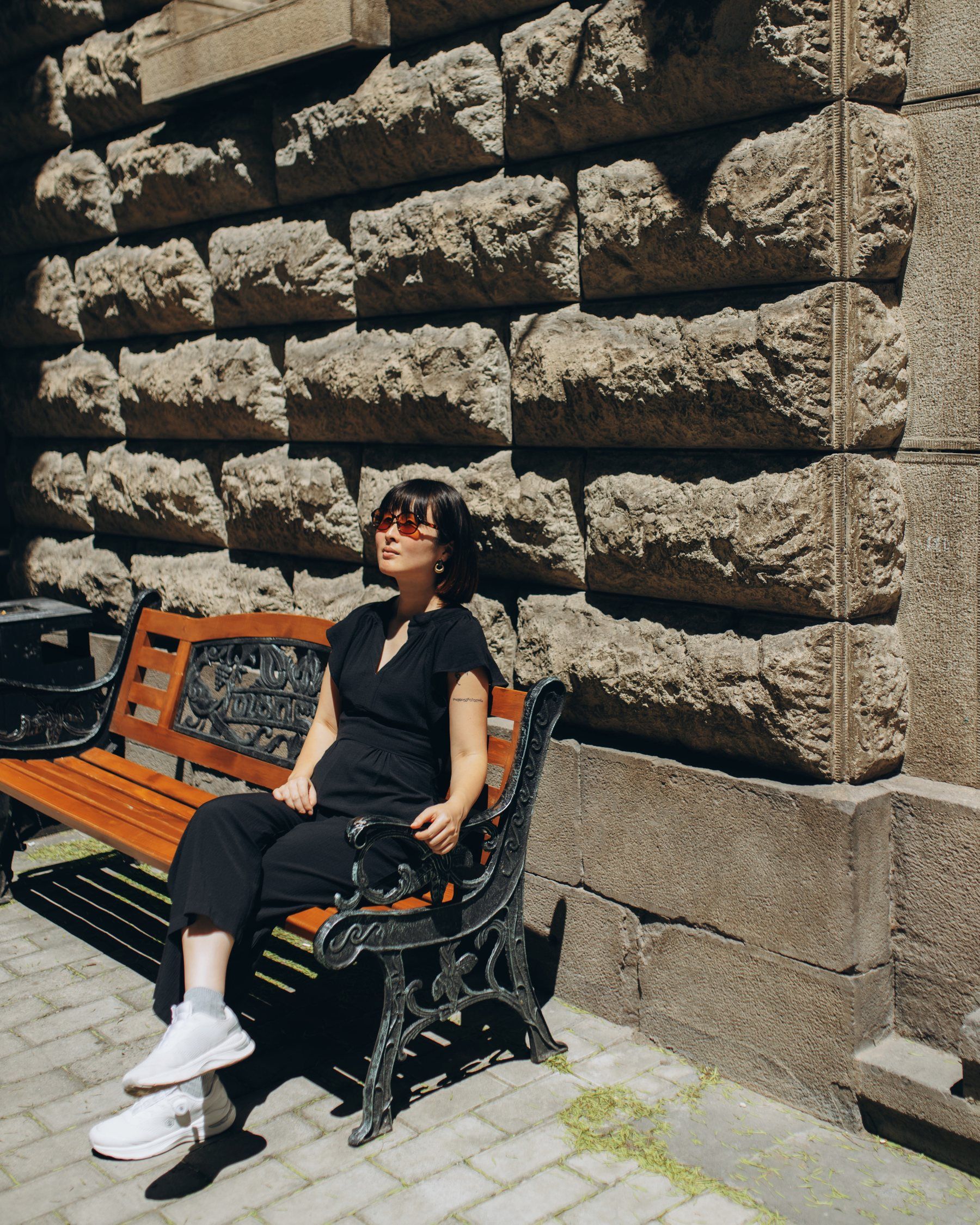 Sumire Sato on a bench in the sun